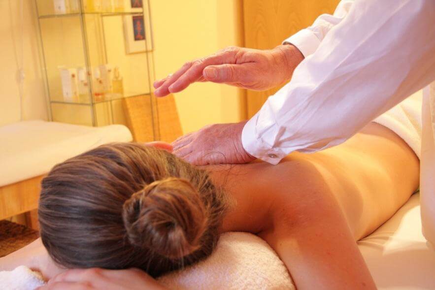 A woman getting a chiropractic spinal adjustment